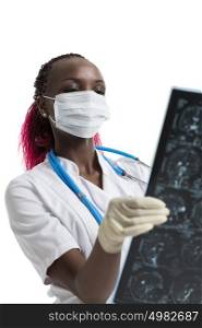 Closeup portrait of intellectual african woman healthcare doctor with white labcoat, looking at brain x-ray radiographic image, ct scan, mri, isolated white background. Radiology department