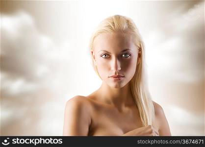 Closeup portrait of naked shoulder blond woman isolated on white background