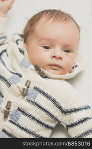 Closeup portrait of newborn baby boy in sweater