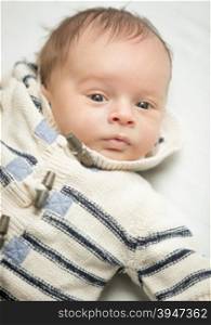 Closeup portrait of newborn baby boy in wool sweater