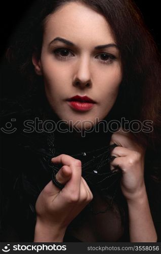 Closeup portrait of passionate young lady. Isolated on black