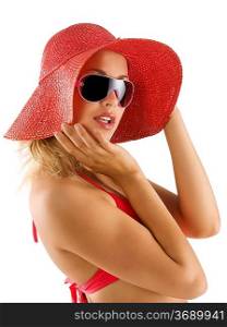 closeup portrait of pretty blond woman wearing a nice summer red hat and sunglasses