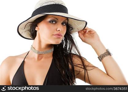 closeup portrait of pretty brunette young woman wearing summer hat looking in camera