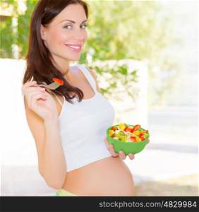 Closeup portrait of pretty woman awaiting baby eating fresh tasty sweet fruits, organic nutrition for pregnant girl, new life concept&#xA;