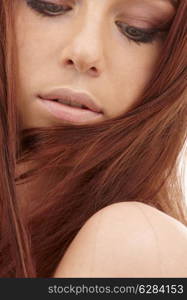 closeup portrait of sensual redhead with long hair