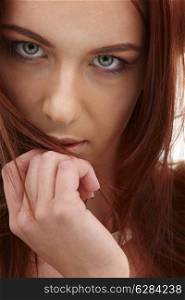 closeup portrait of sensual redhead with long hair