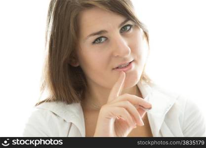 Closeup portrait of sexy brunette woman holding condom and looking at camera