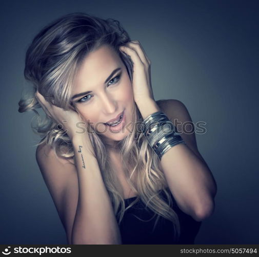 Closeup portrait of sexy female model isolated on dark background, perfect makeup and hairstyle, fashion and seduction concept