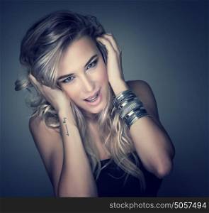 Closeup portrait of sexy female model isolated on dark background, perfect makeup and hairstyle, fashion and seduction concept