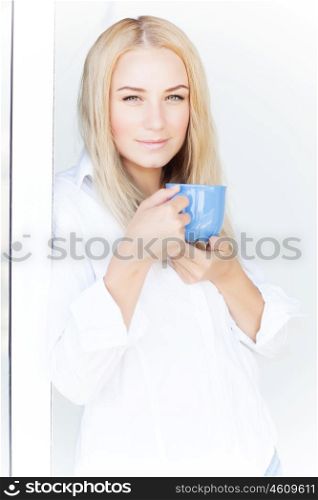 Closeup portrait of sexy girl drink tea at home near window, beautiful female have breakfast, peace and pleasure concept