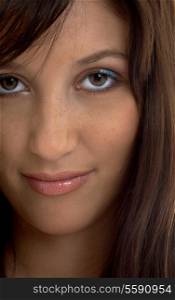 closeup portrait of smiling brunette with long hair