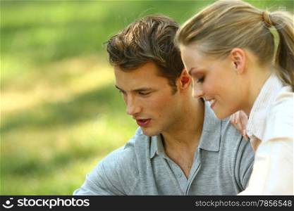 Closeup portrait of smiling young couple in love - Outdoors