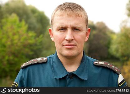 closeup portrait of the military man standing outdoors
