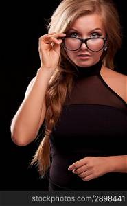 closeup portrait of woman in black glasses on black background