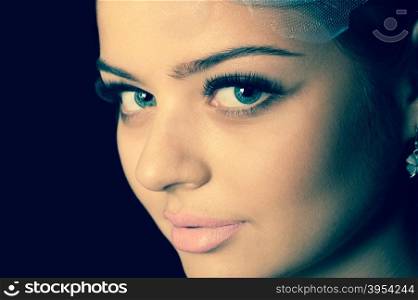 Closeup portrait of young beautiful woman, toned image