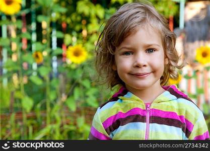 closeup portrait of young girl outdoors with sunflowers