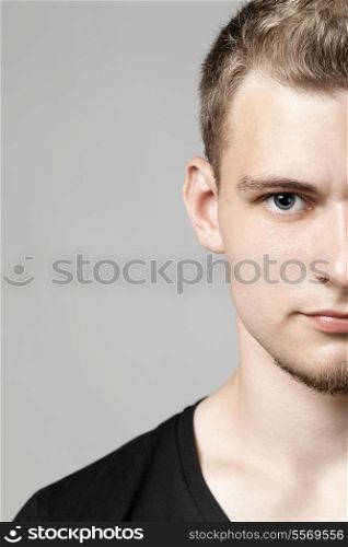 closeup portrait of young man isolated on light background