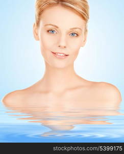 closeup portrait picture of beautiful woman in water