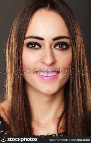 Closeup portrait smiling woman face, brunette long hair girl dark makeup