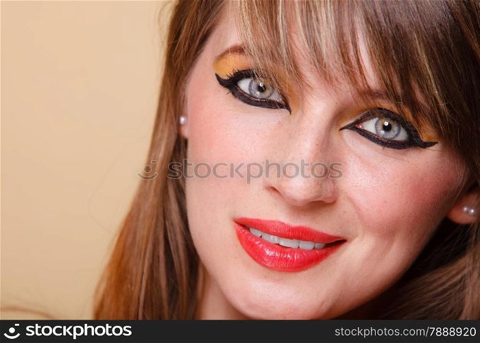 Closeup portrait young attractive orient eastern girl with perfect make-up. Woman with beauty makeup eye liner red lips.