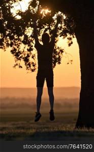 Closeup portrait young man alone jump at sunset