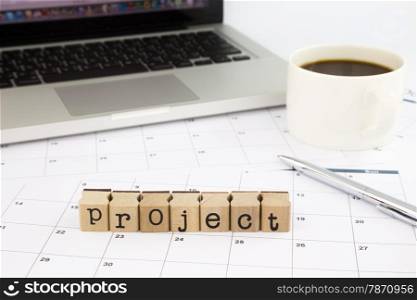 closeup project wording, schedule and calendar for project planning, business concept and idea
