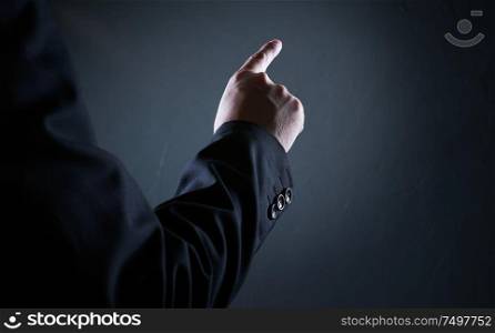 Closeup rear angle view of businessman pressing gesture pose .