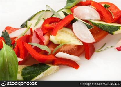 closeup salad from colored fresh vegetables on plate