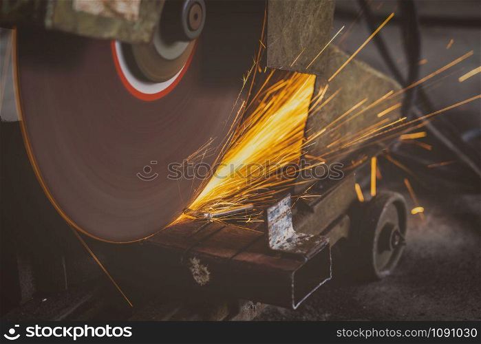 Closeup saw machine or metal cutting working in metalworking factory, lathe metalworking industry concept