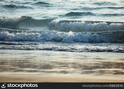 Closeup sea waves. Closeup sea waves coming on beach at sunset light