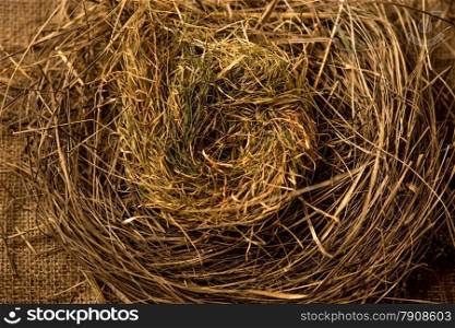 Closeup shot of birds nest made of straws