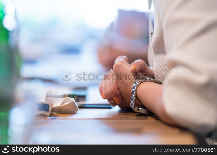 closeup shot of business people hands using pen while taking notes on education training during business seminar at modern conference room