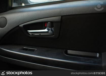 Closeup shot of button locking doors in car. not closed door in car.. not closed door in car