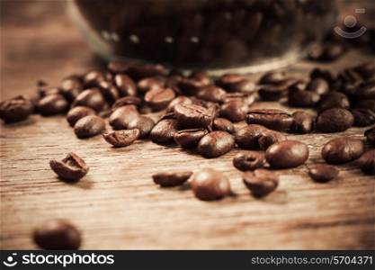 Closeup shot of coffee beans on a wooden table