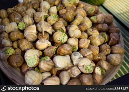 Closeup shot of dish full of fresh snails