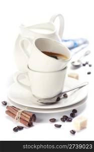 Closeup shot of freshly prepared cup of italian espresso and milk over white