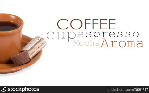 Closeup shot of freshly prepared cup of italian espresso with cinnamon and candy over white background