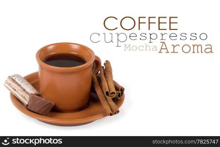 Closeup shot of freshly prepared cup of italian espresso with cinnamon and candy over white background