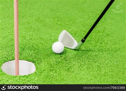 closeup shot of golf on a green field