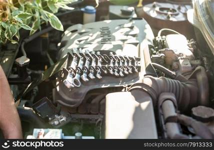 Closeup shot of set of repairing tools on car engine