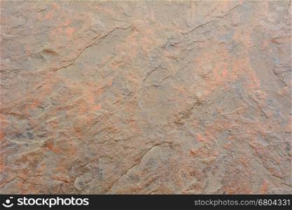 Closeup shot with dark orange tile background.