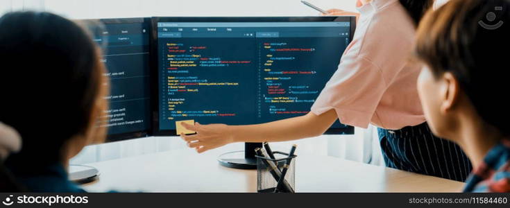 Closeup skilled young female programer present program coding and sharing programing idea while manager listening carefully.at modern office company. Java script, web design concept. Burgeoning.. Female programer present program coding while manager listening. Burgeoning.