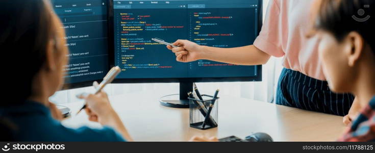 Closeup skilled young female programer present program coding and sharing programing idea while manager listening carefully.at modern office company. Java script, web design concept. Burgeoning.. Female programer present program coding while manager listening. Burgeoning.