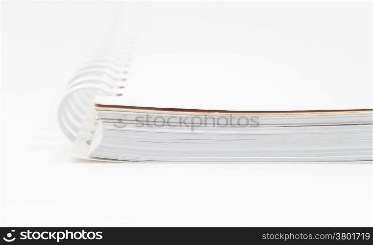 Closeup spiral notepad isolated on white background, stock photo