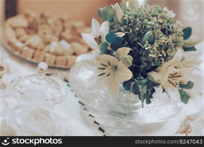 Closeup Still Life of a Gorgeous Gentle White Floral Bouquet. Tender Centerpiece. Wedding Table Decoration. Centerpiece of a Wedding Table