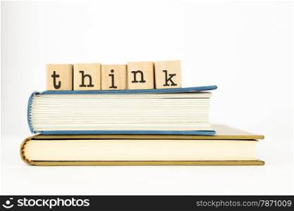 closeup think wording stack on books isolate on white background, concept and idea for education
