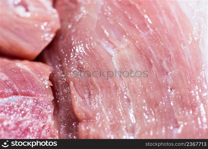 Closeup top view piece fresh raw meat of pork. Closeup pieces of raw pork meat