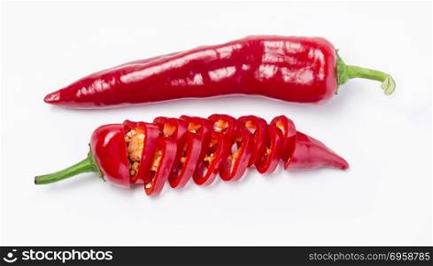 Closeup top view red chili pepper with sliced on white background, raw food ingredient concept. pepper isolated on white