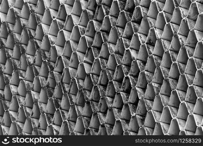 Closeup ventilated facade of building. White ventilation with creative and beautiful pattern architecture. Exteriors architecture abstract background. Dirty ventilated facade with black stains.