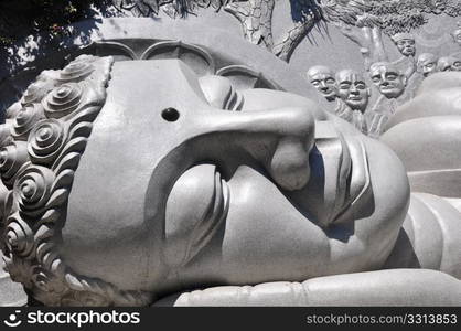 Closeup view of a historic lying buddha statue